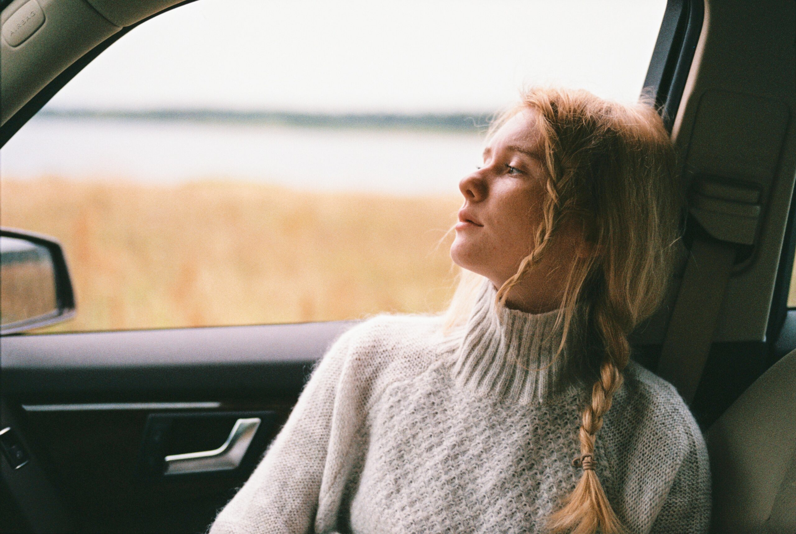 Girl looking out window